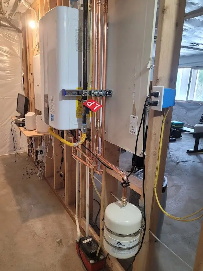 Licensed plumber repairing a kitchen sink in McNair